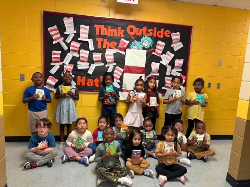 Mrs. Sullivan's Pre-K class holding up their Dr. Seuss board books.