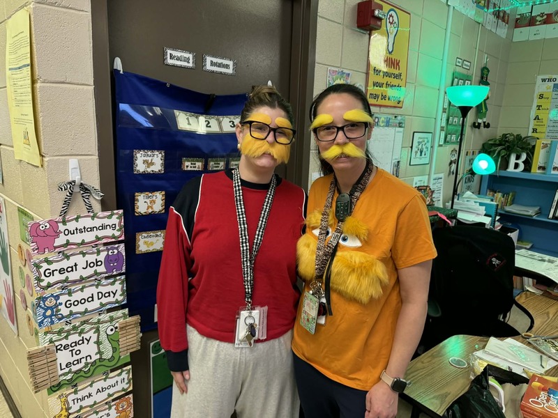 First grade teachers, Miss Rafey and Miss Bordelon, with their Lorax mustaches on.