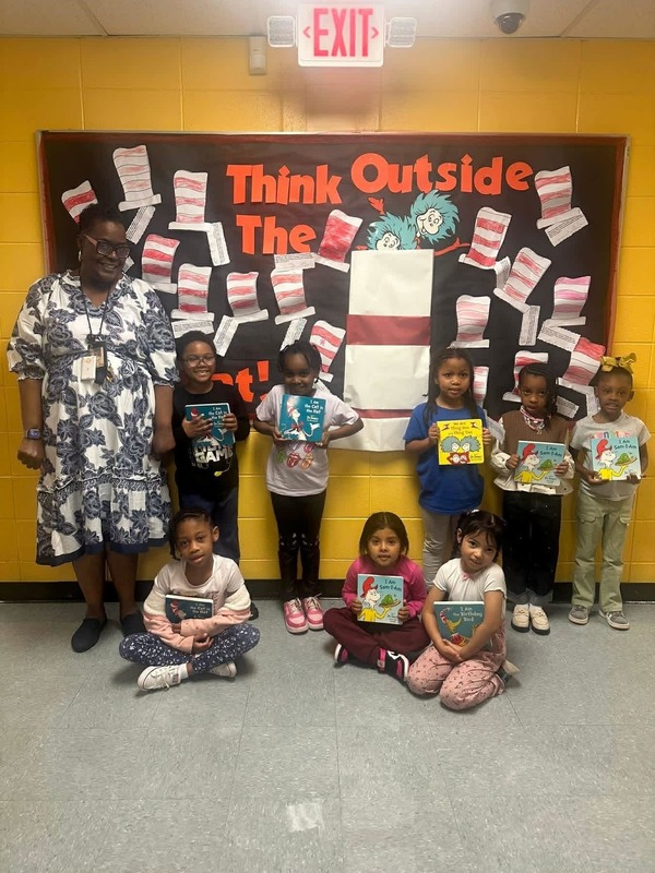 Miss William's Kindergarten Class showing off their new Dr. Seuss board books.