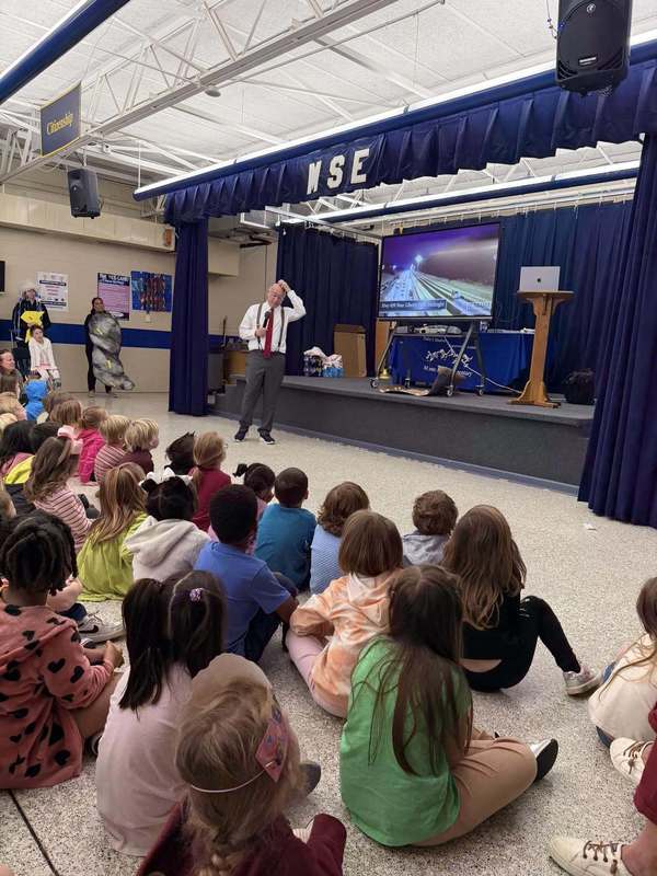 James Spann standing in front of students presenting 
