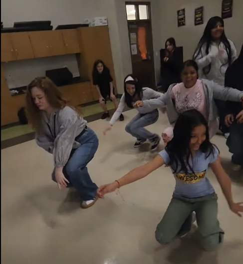 Ms. Carlton and students dancing