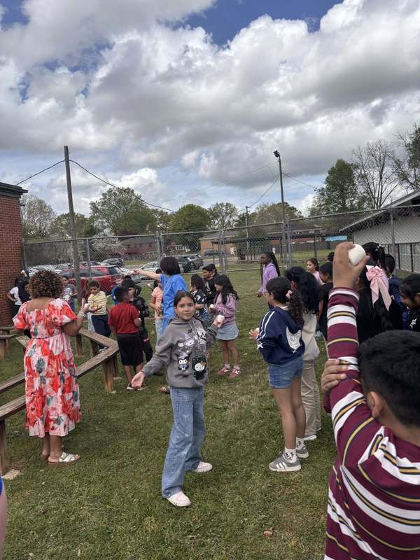 Third graders holding up marshmallows for the Lirpa Loof