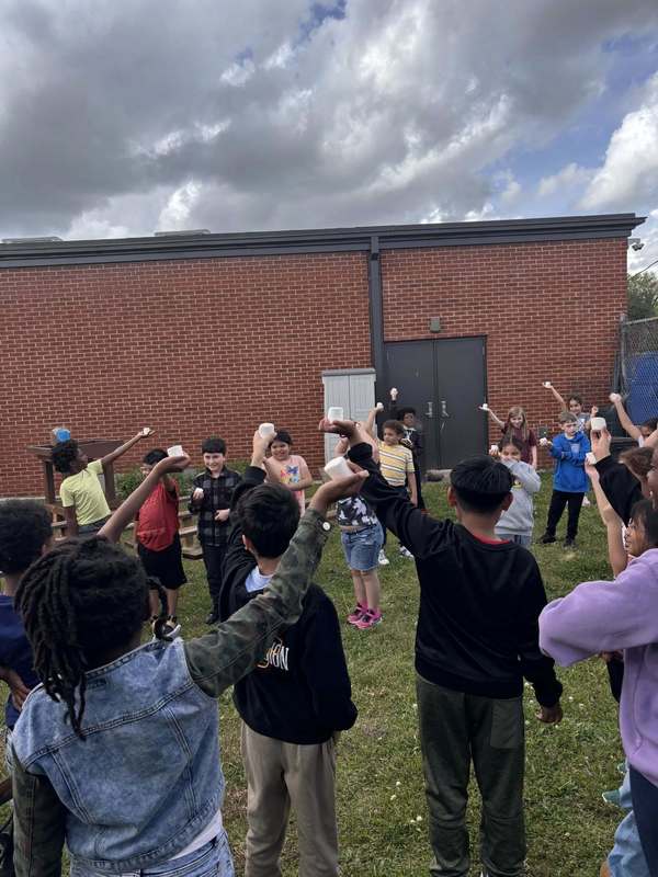 Third graders trying to entice the Lirpa Loof with marshmallows.