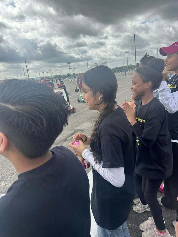 Students cheering on their team members in the race!