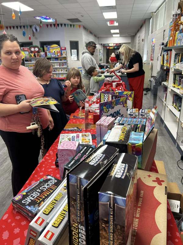 Mrs. Gatzke manning the register at the book fair