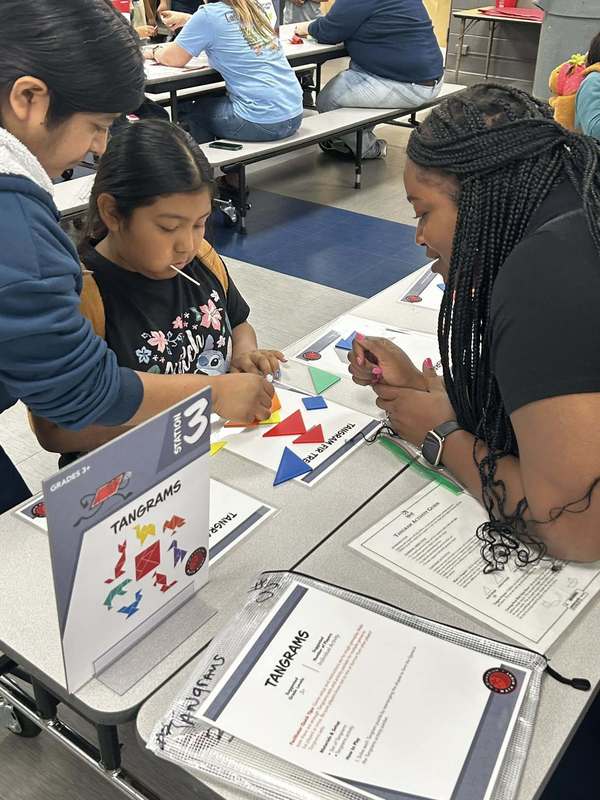Students enjoying a math game in the cafeteria