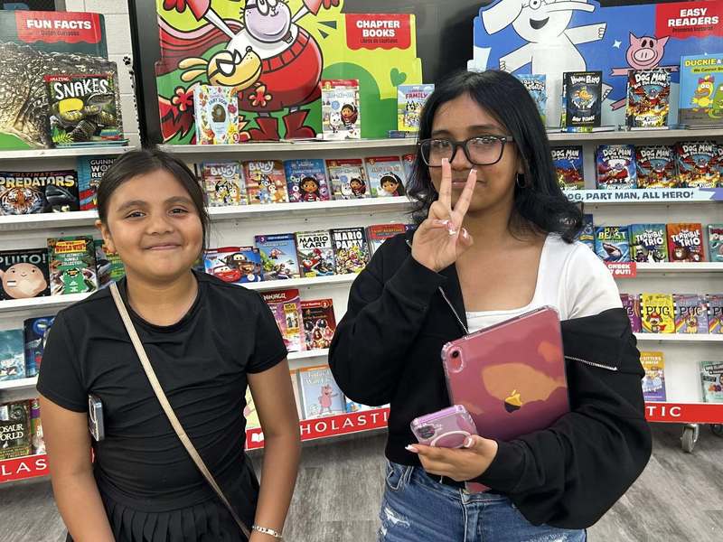 Students shopping the book fair at Family Fun Night