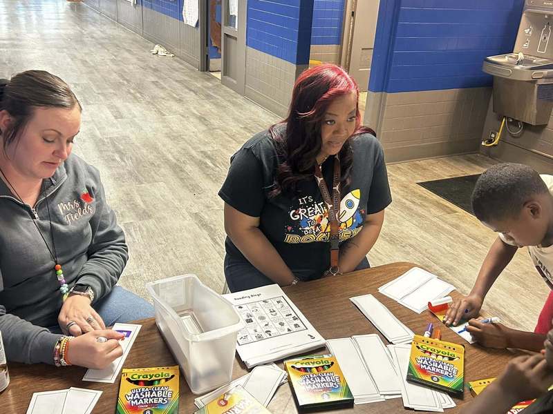 Mrs. Fields and Mrs. Dodson representing second grade at the literacy tables