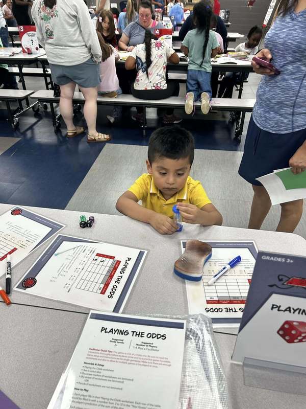 A student learning at Family Fun Night