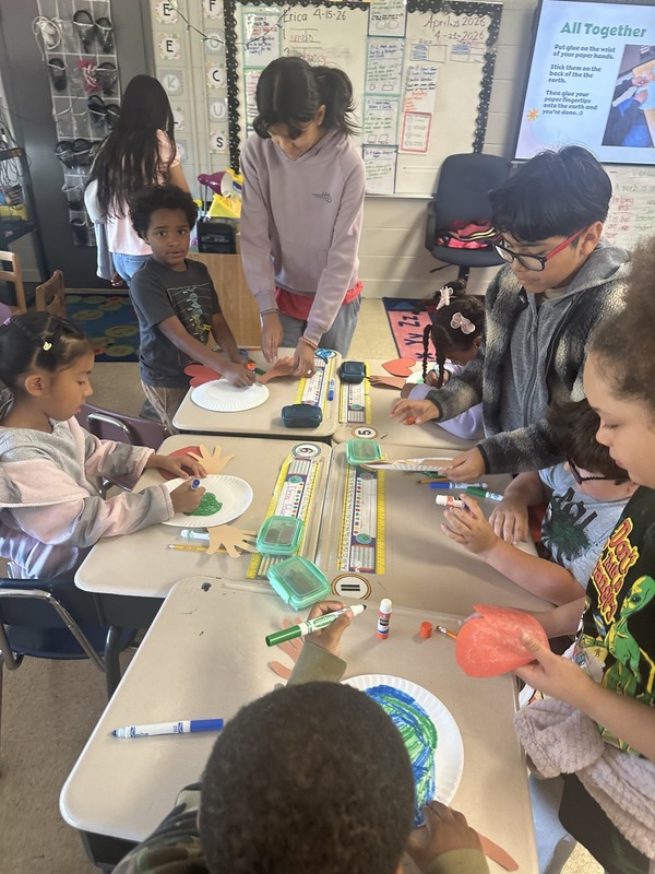GATE students and first graders making an Earth Day craft.