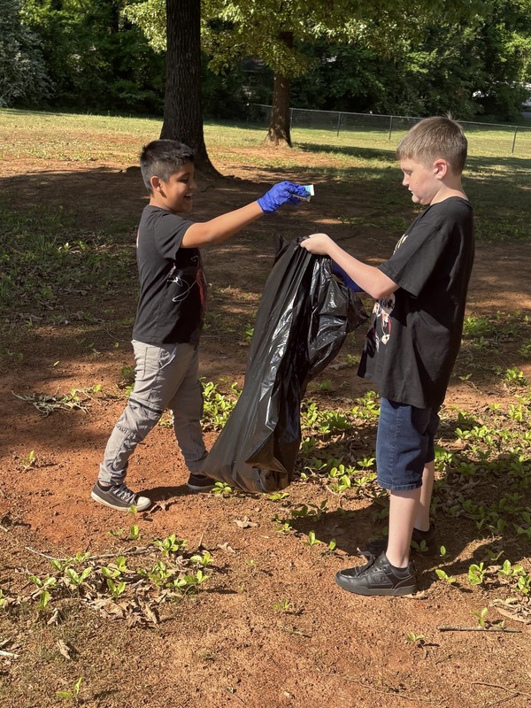 Students cleaning up around our campus