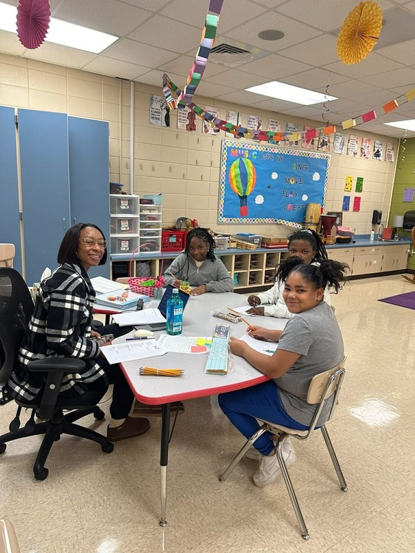 Students working with Ms. Lanier in the Fashion Club