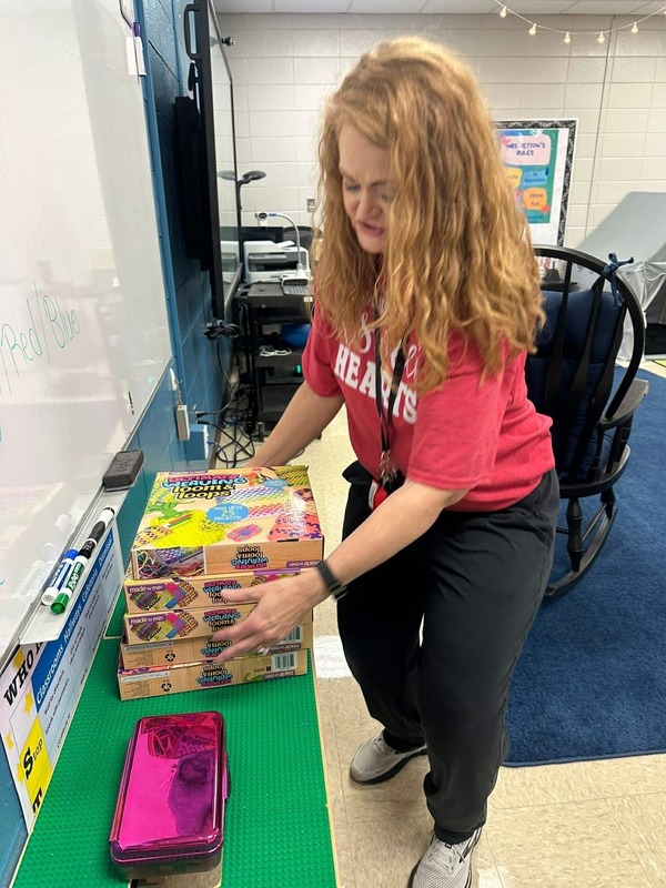 Mrs. Jetton getting her looming kits ready for her club.