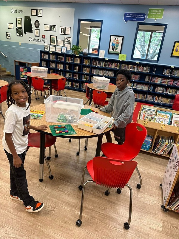 Students are being creative with their Legos in their Lego Club. 
