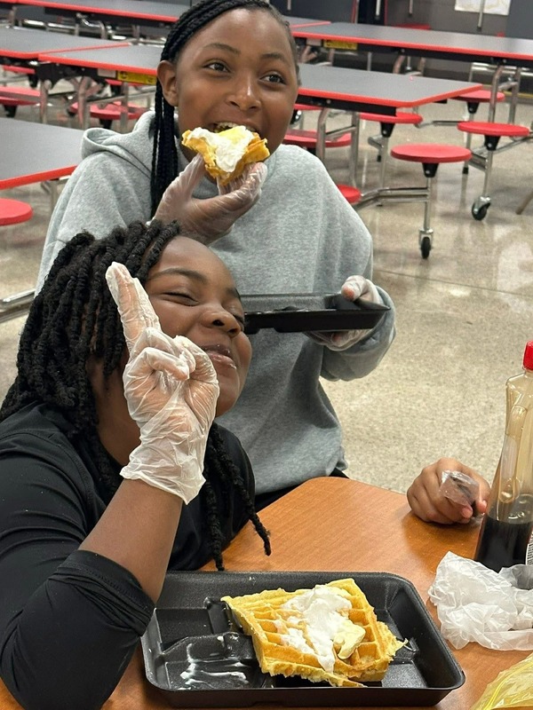 4th graders, Justyce and Marley, enjoying waffles during their Cooking Club.