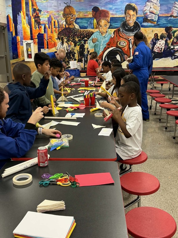 3rd grade students building their rockets.