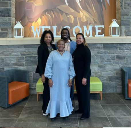 Dr. Burruss posing with Mrs. Lattimore, Mrs. Stallworth-Brown, and Mr. Palmer