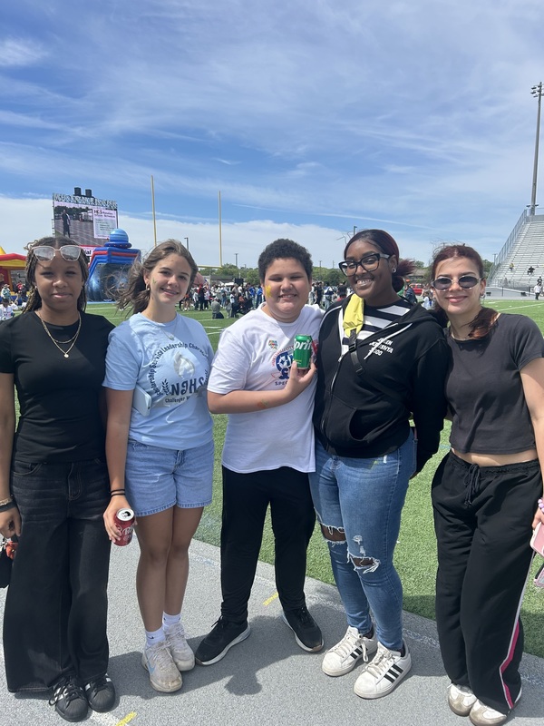 Blaze with the middle school peer helpers helping at the Olympics. 