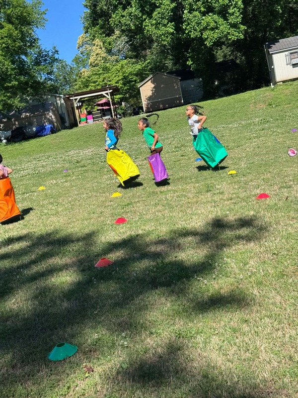 Students jumping during the sack races.