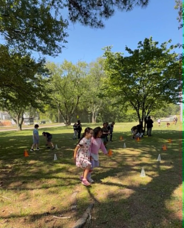 Students running during the 3-legged race.