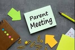 Parent Meeting sign with office supplies