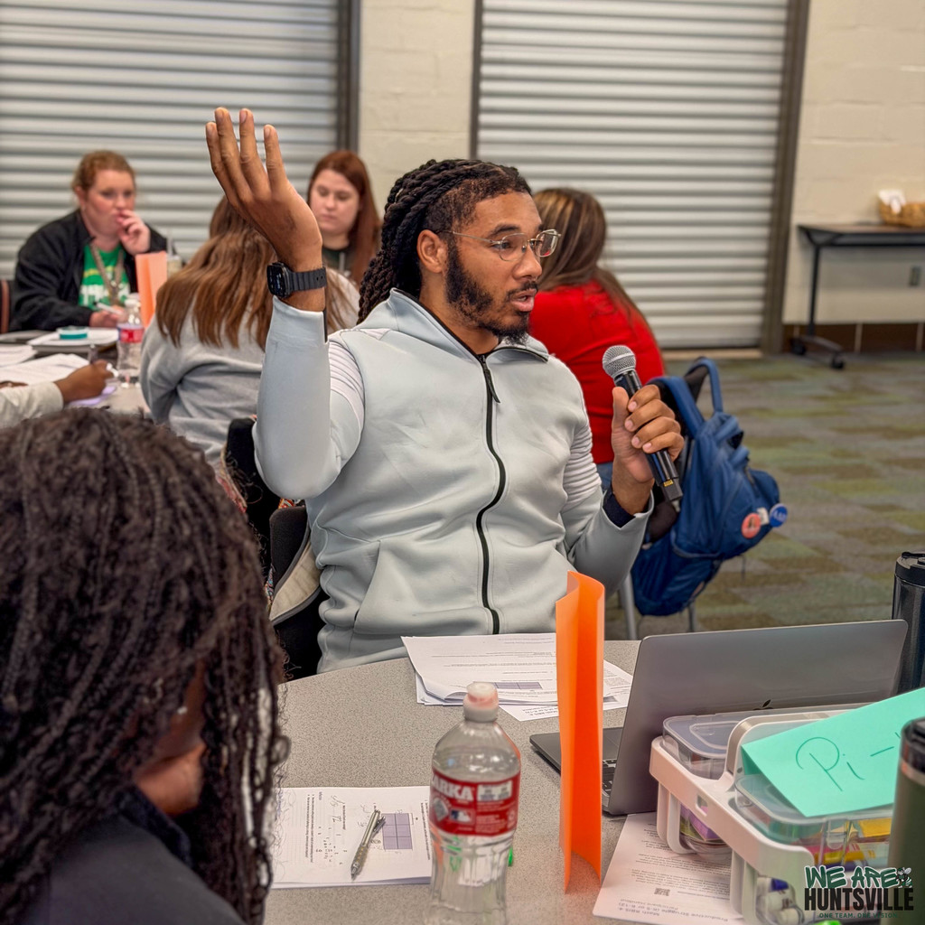 Man raising hand making point