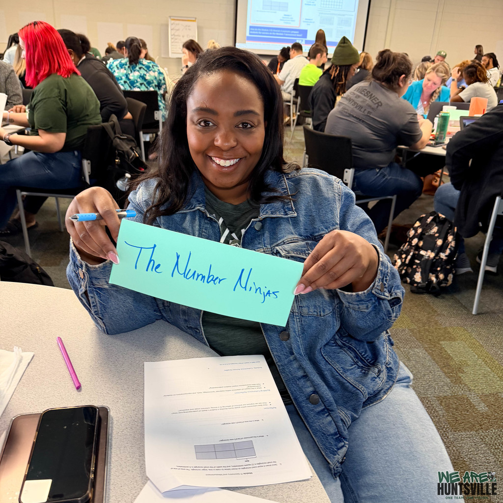 Teacher holding up funny sign