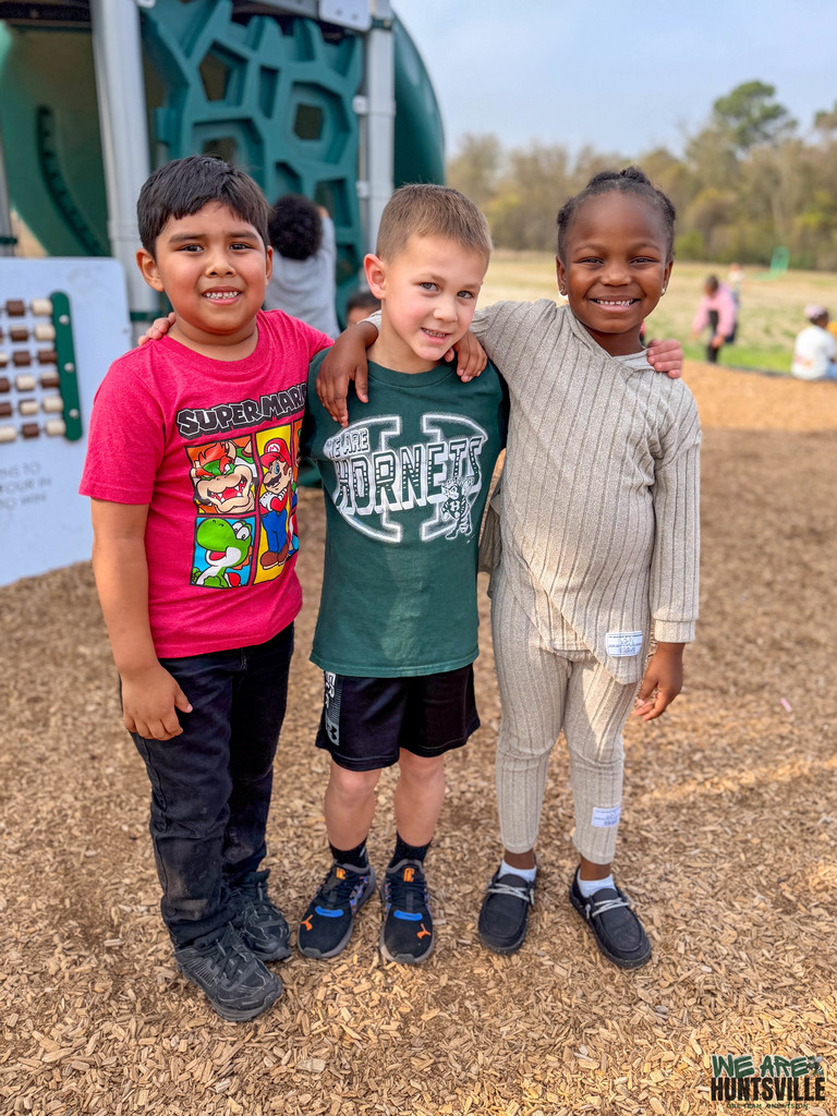 Photo of three smiling kids- 