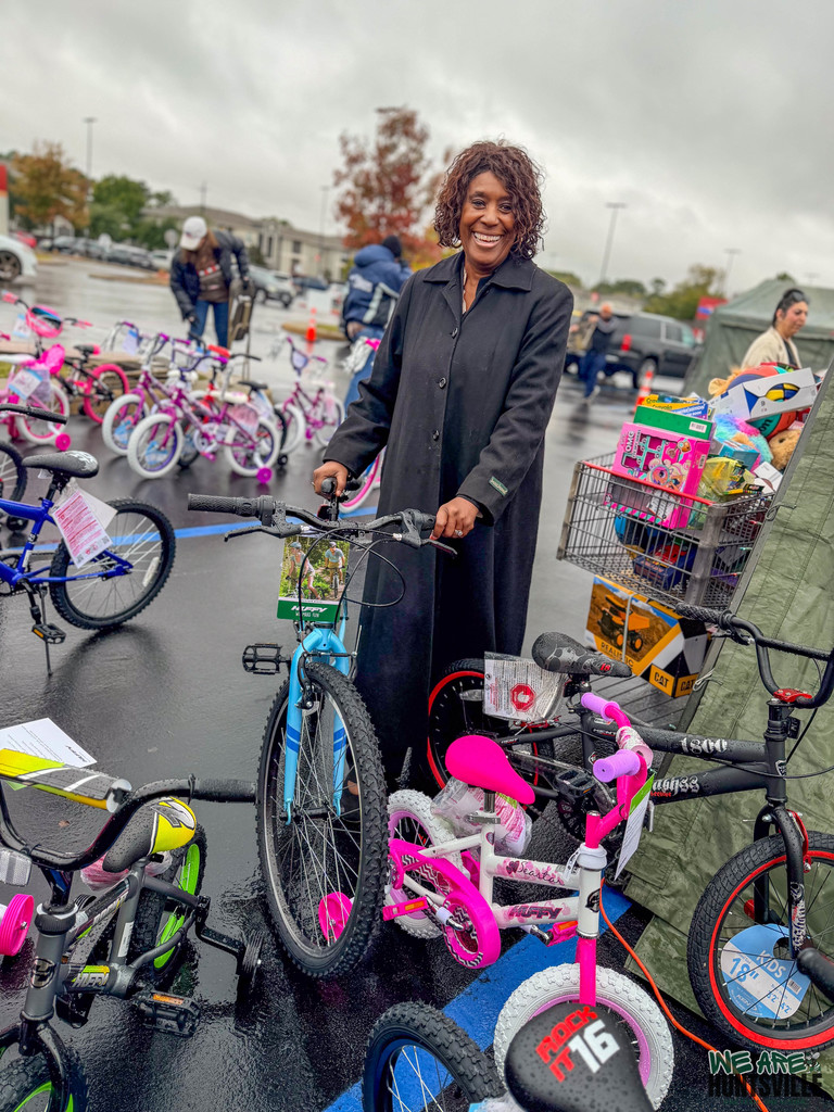 HISD employee holding a bike