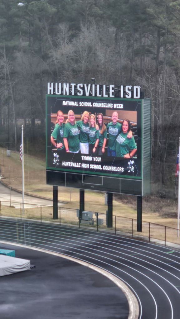 This is an image of the first group photo projected on a big screen outside