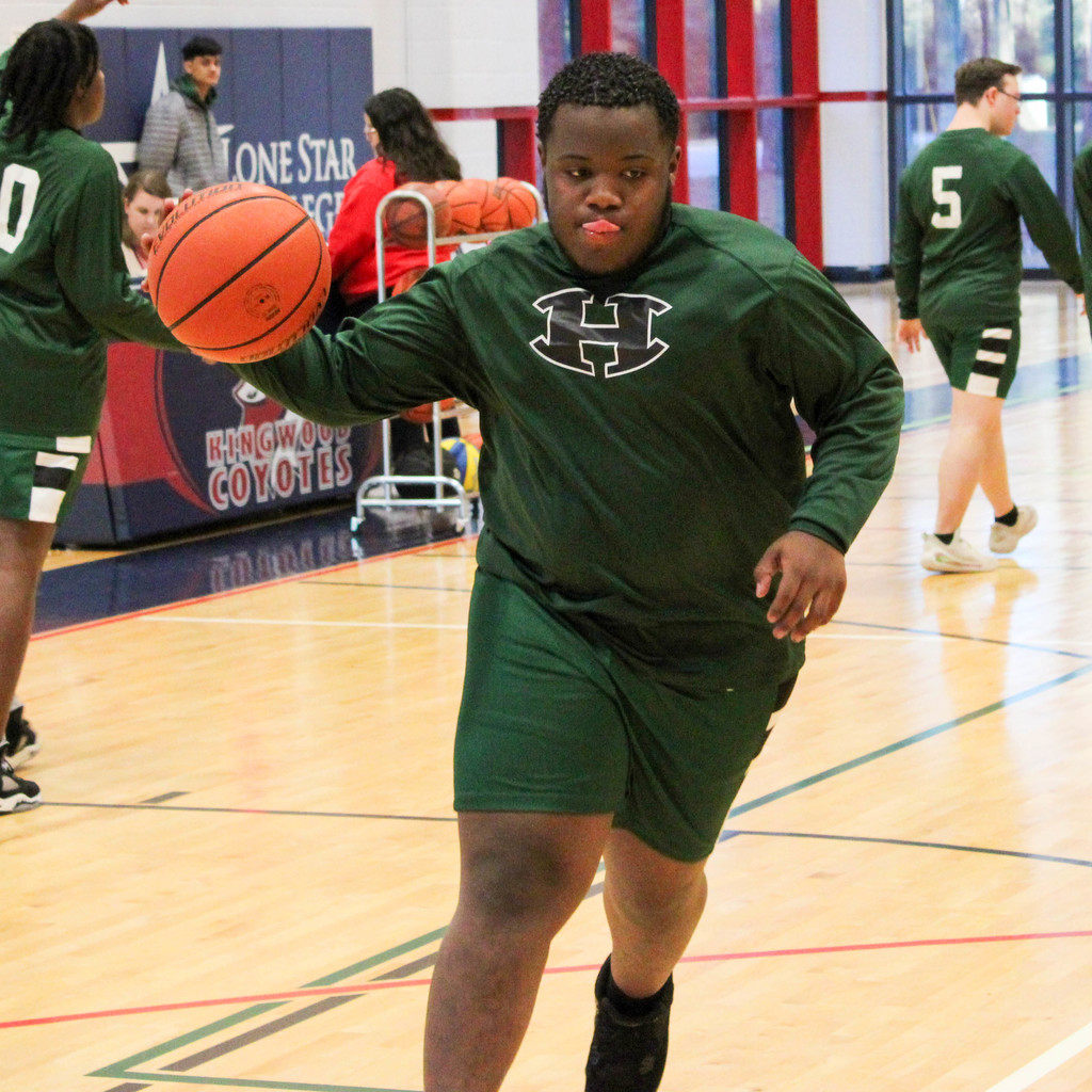 Boy Dribbles basketball