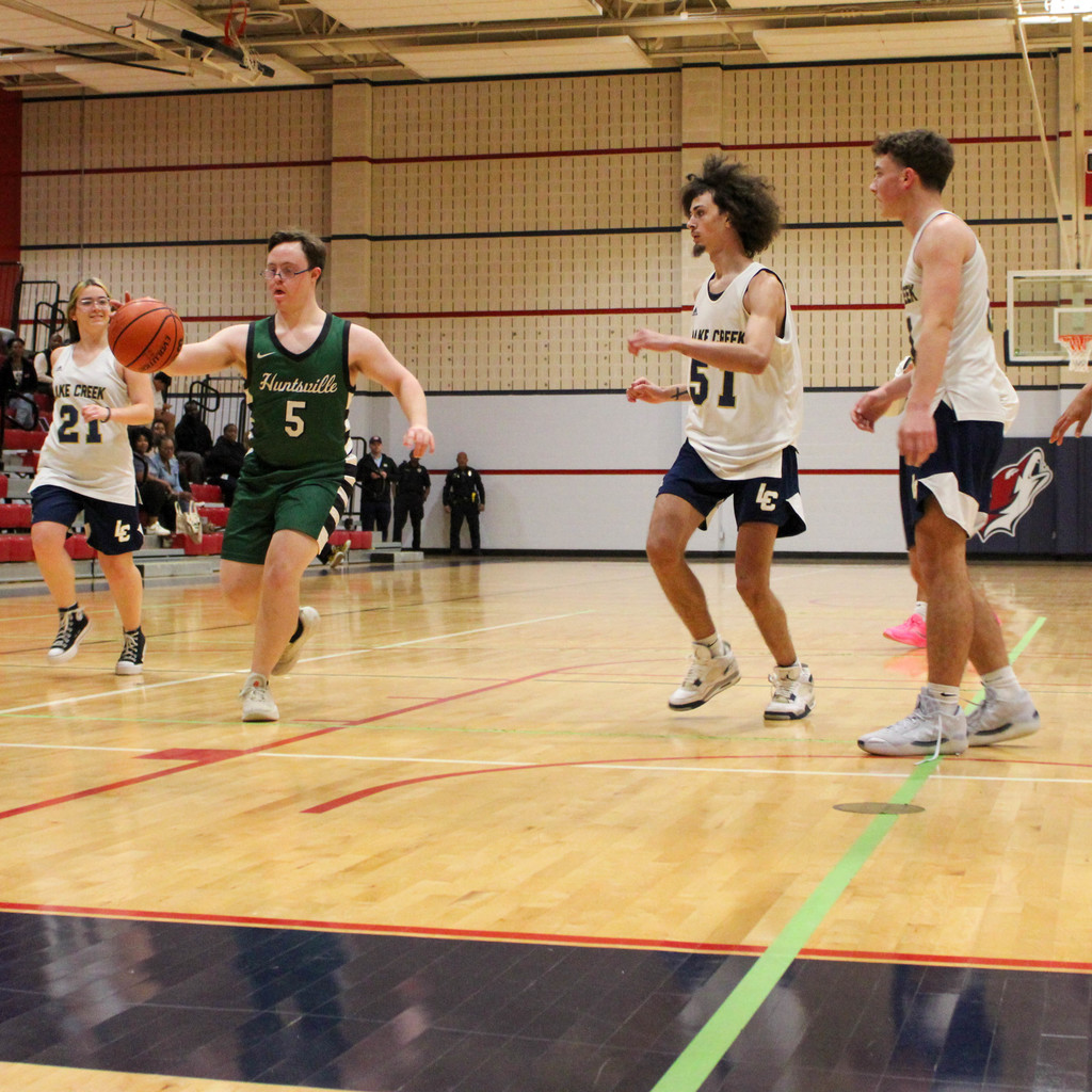 dribbling donw the court