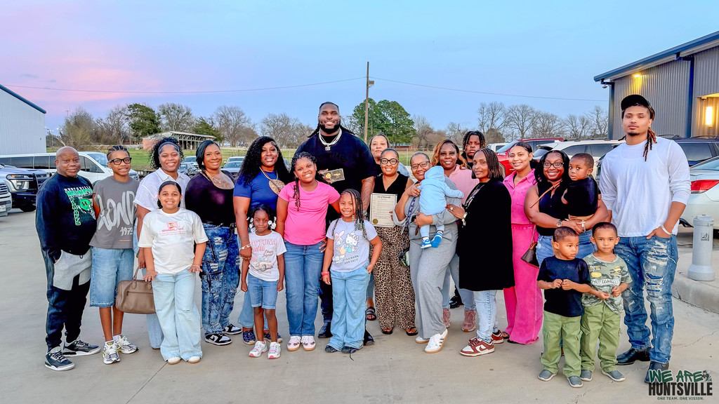 T'vondre Sweat with his family friends Getting the Key to the City- group with podium