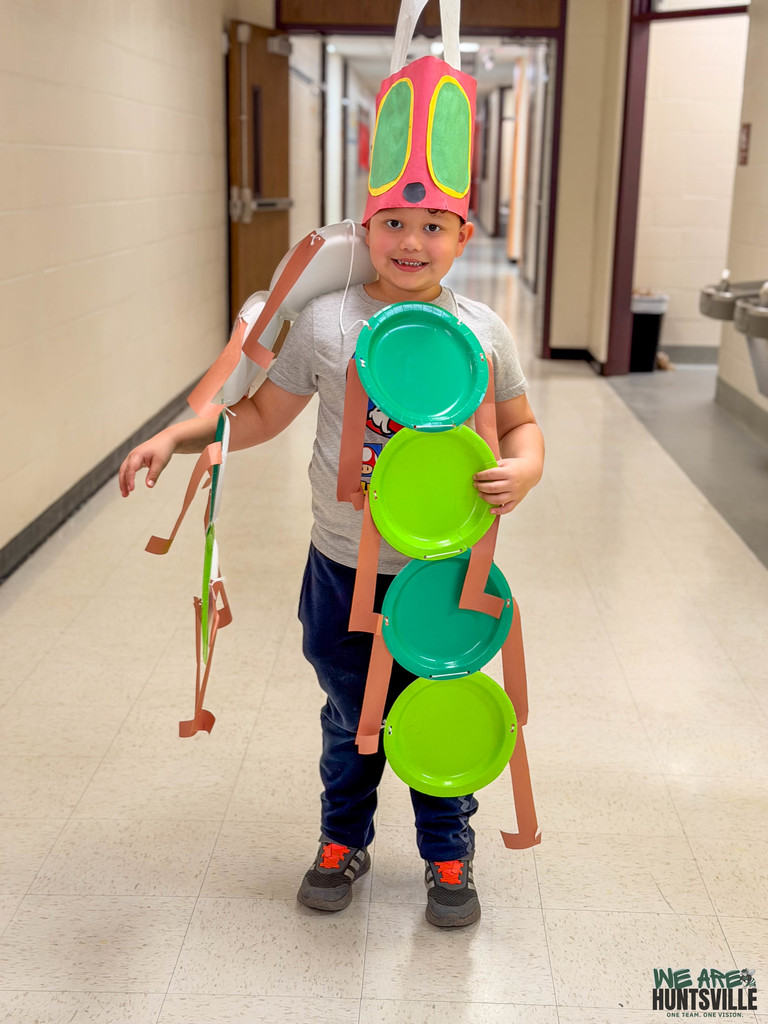 a kid dressed up as the hungry caterpillar