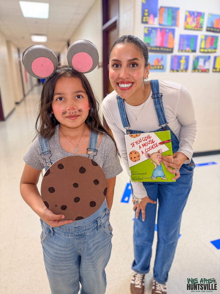 student and teacher posing