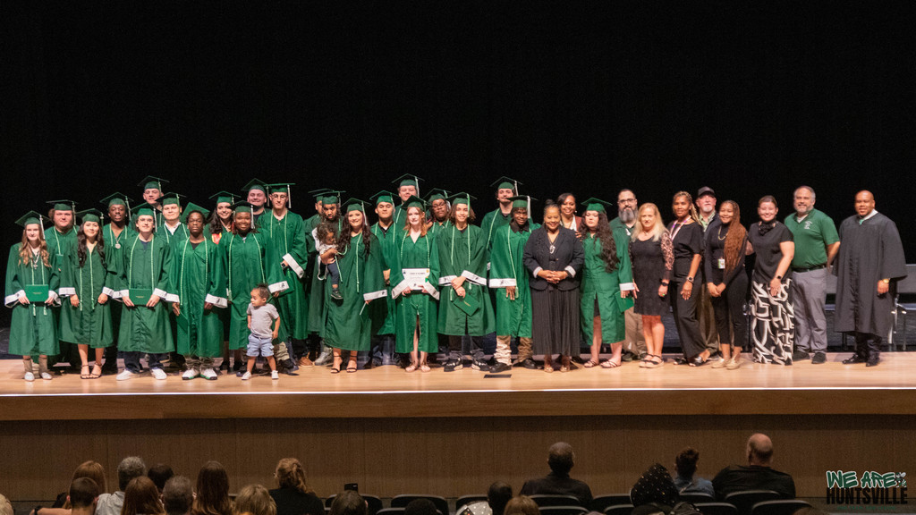 Group photo of all the graduates on stage