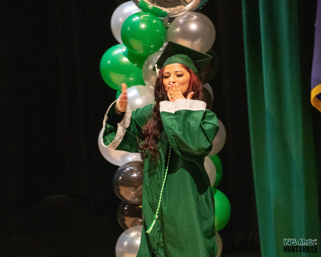 Graduate blows kisses