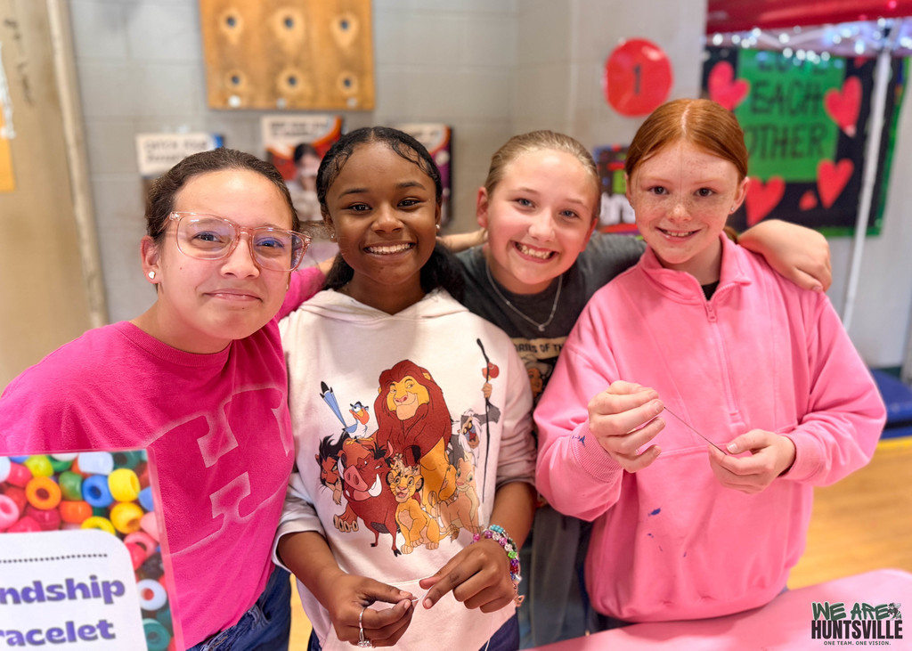 four friends taking a break for aphoto