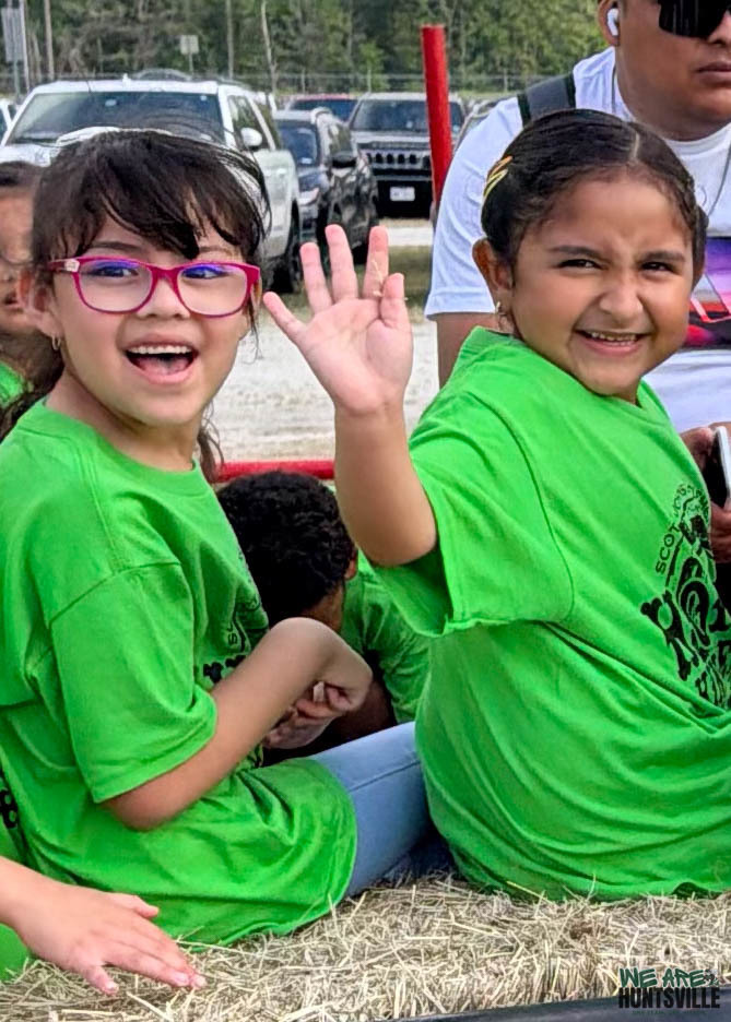 two kinder girls on a hay ride