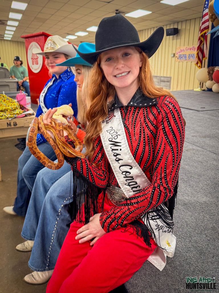 miss congeniality holding a snake