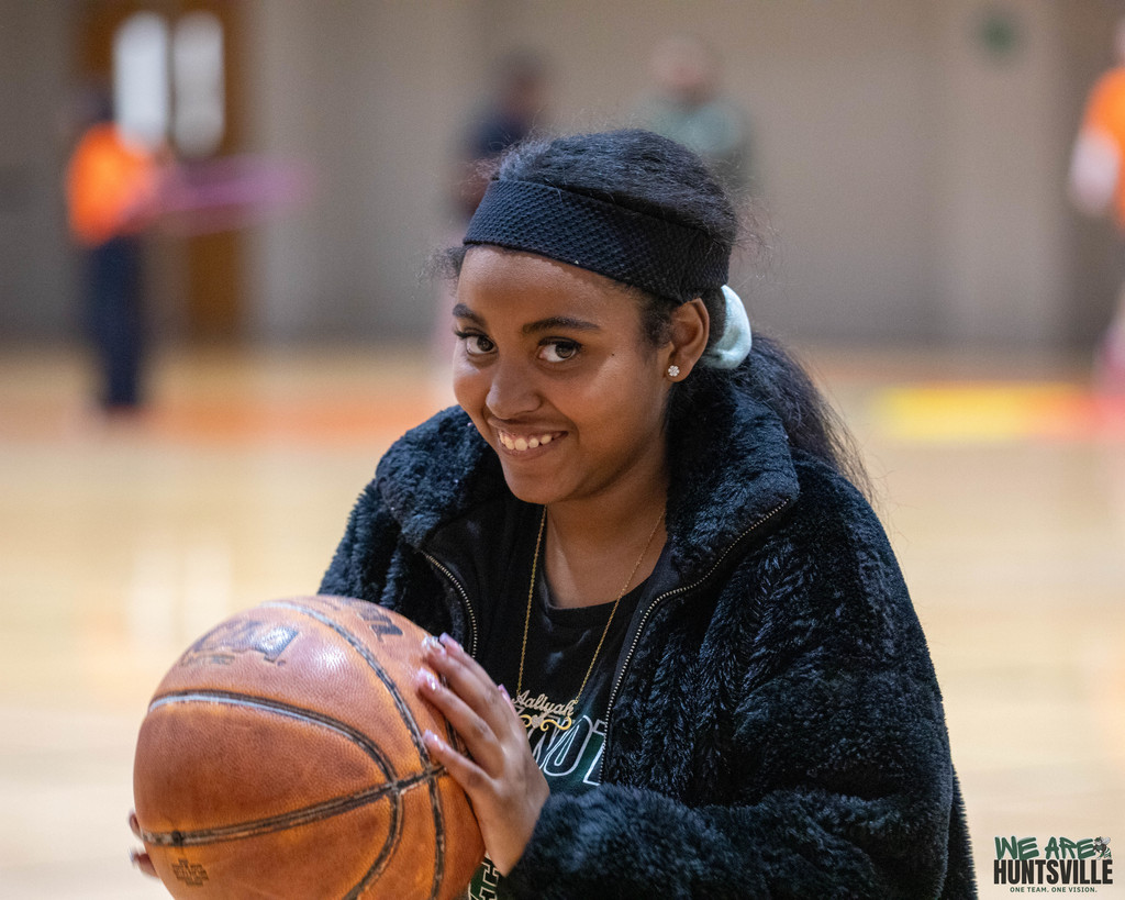 Student holding basketball