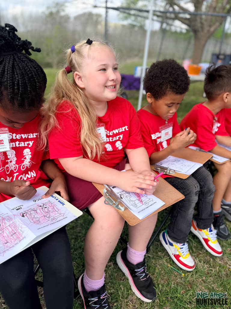 Girl smiling with activity in lap