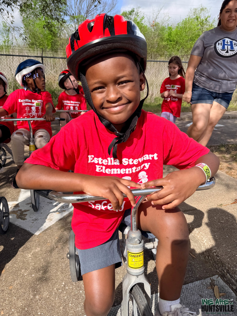 Kid kicking it on a tricycle