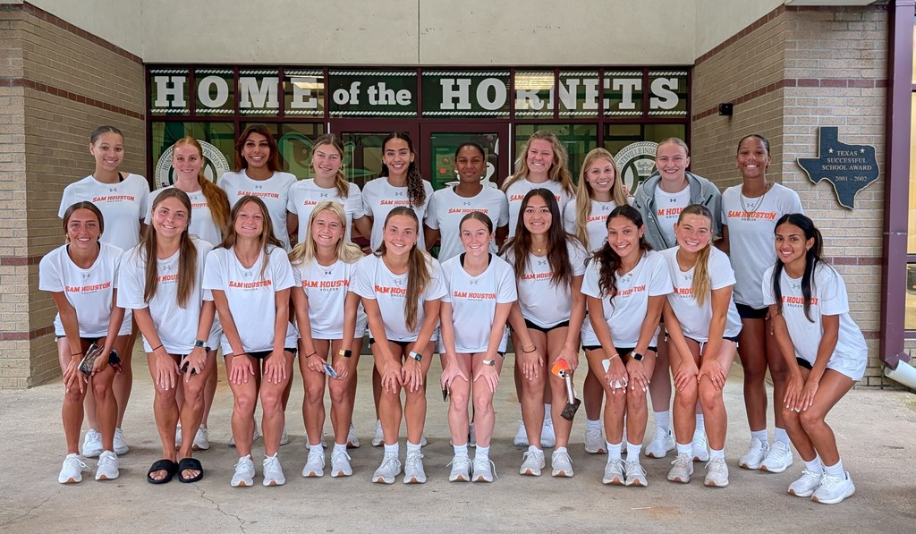 SHSU Women's Soccer Team helps in the drop-off line.
