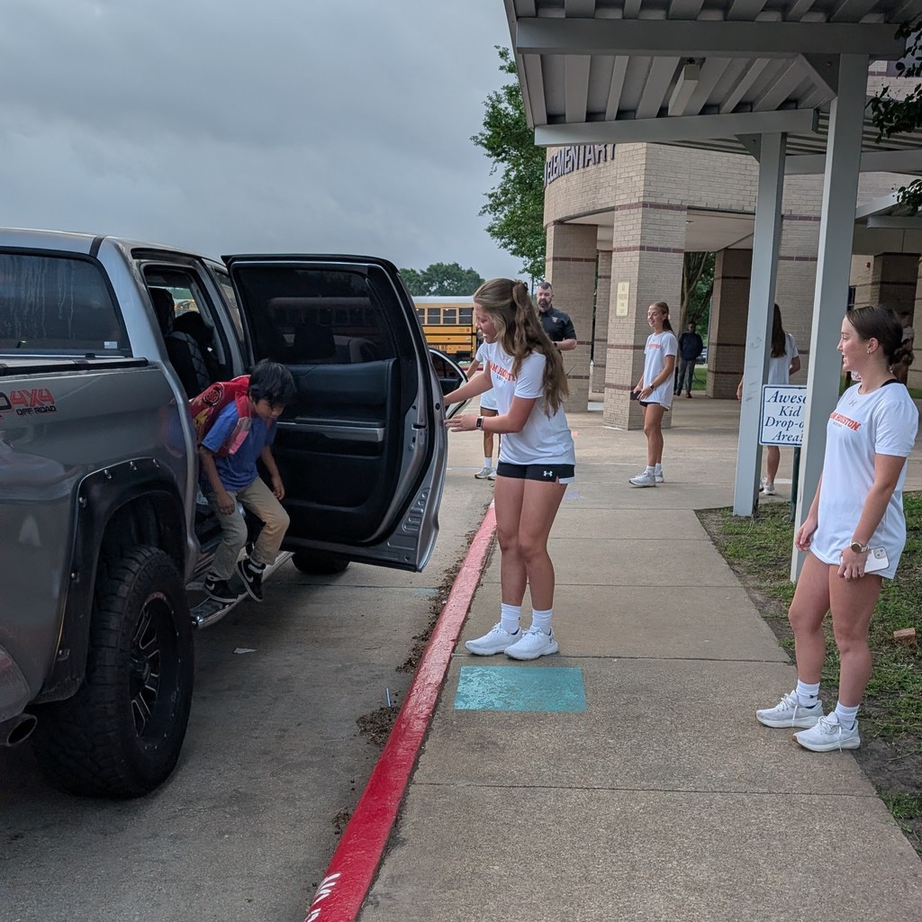 SHSU Women's Soccer Team helps in the drop-off line.