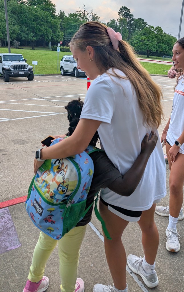 SHSU Women's Soccer Team helps in the drop-off line.