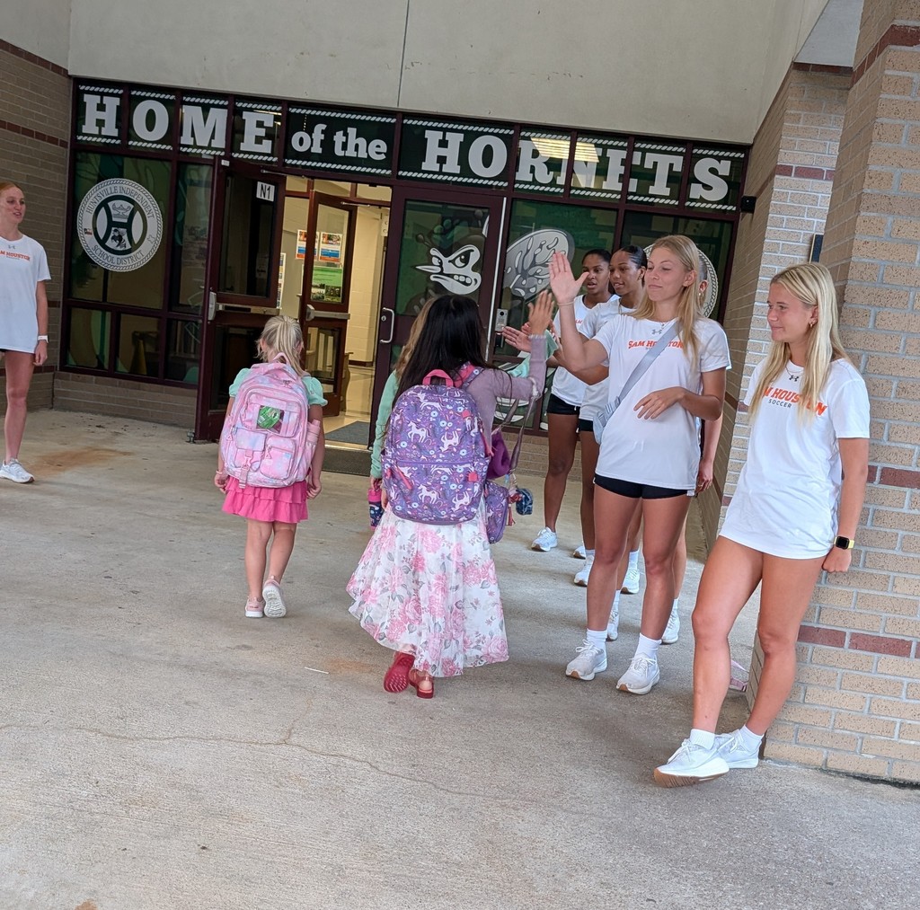 SHSU Women's Soccer Team helps in the drop-off line.