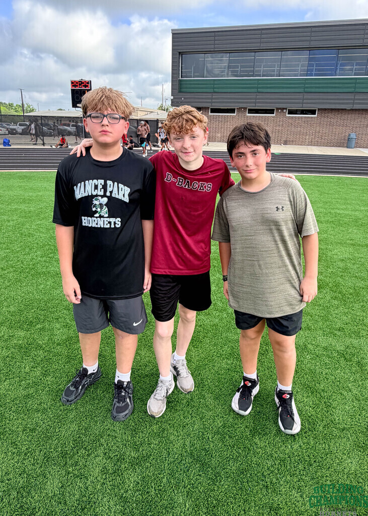 three middle schoolers looking hard