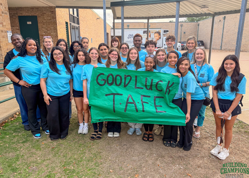 Group photo with sign- Good Luck TAFE!