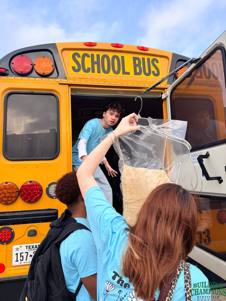 Student handing luggage